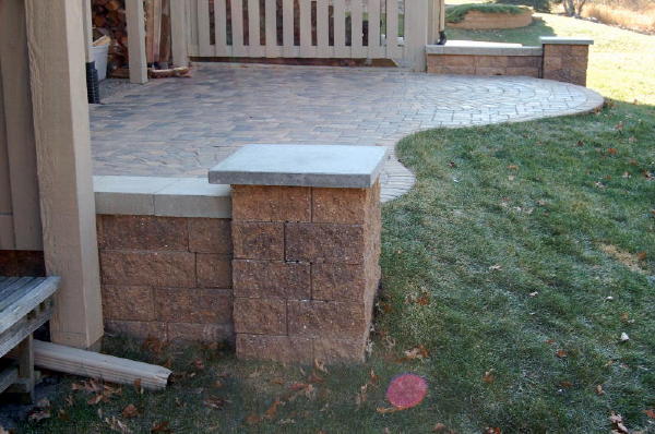 Pavers: Cobble Series Color: Lakeshore Blend, Chestnut Blend 50/50 mix Pattern: Random cobble Style: Raise Patio with free standing walls, columns. Walls: VERSA-LOK chestnut blend block. Location: Near Sterling and Mailand in South Titusville Install Date: September 2008