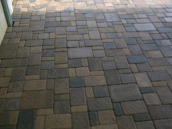 Pavers: Cobble Series Color: Chestnut, Lakeshore blends mix Pattern: Random cobble with 1/2 circles Border: rectangle Charcoal color Location: Near 694 and Century and the golf coarse Install Date: July 2008